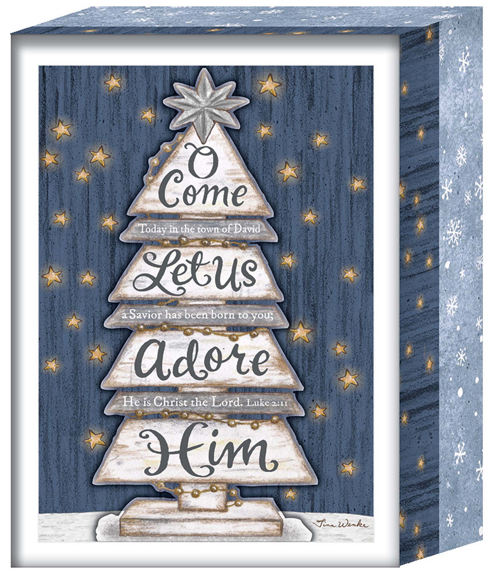 Decorative Christmas box with star design and text on a blue wooden background