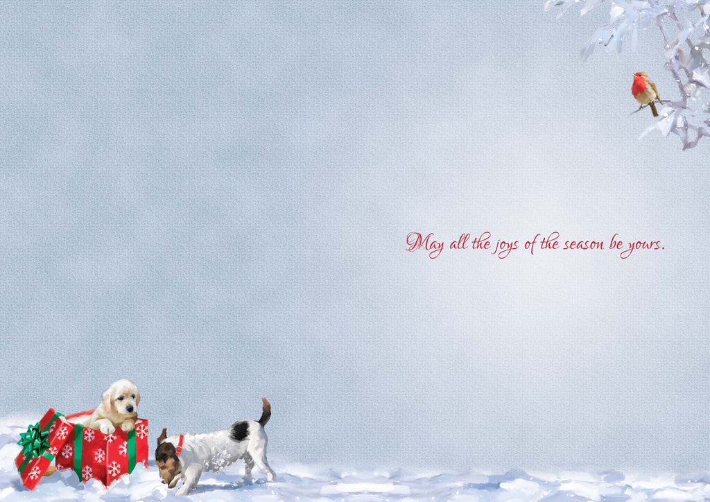 Two dogs with Christmas presents in a snowy landscape with a bird on a branch.