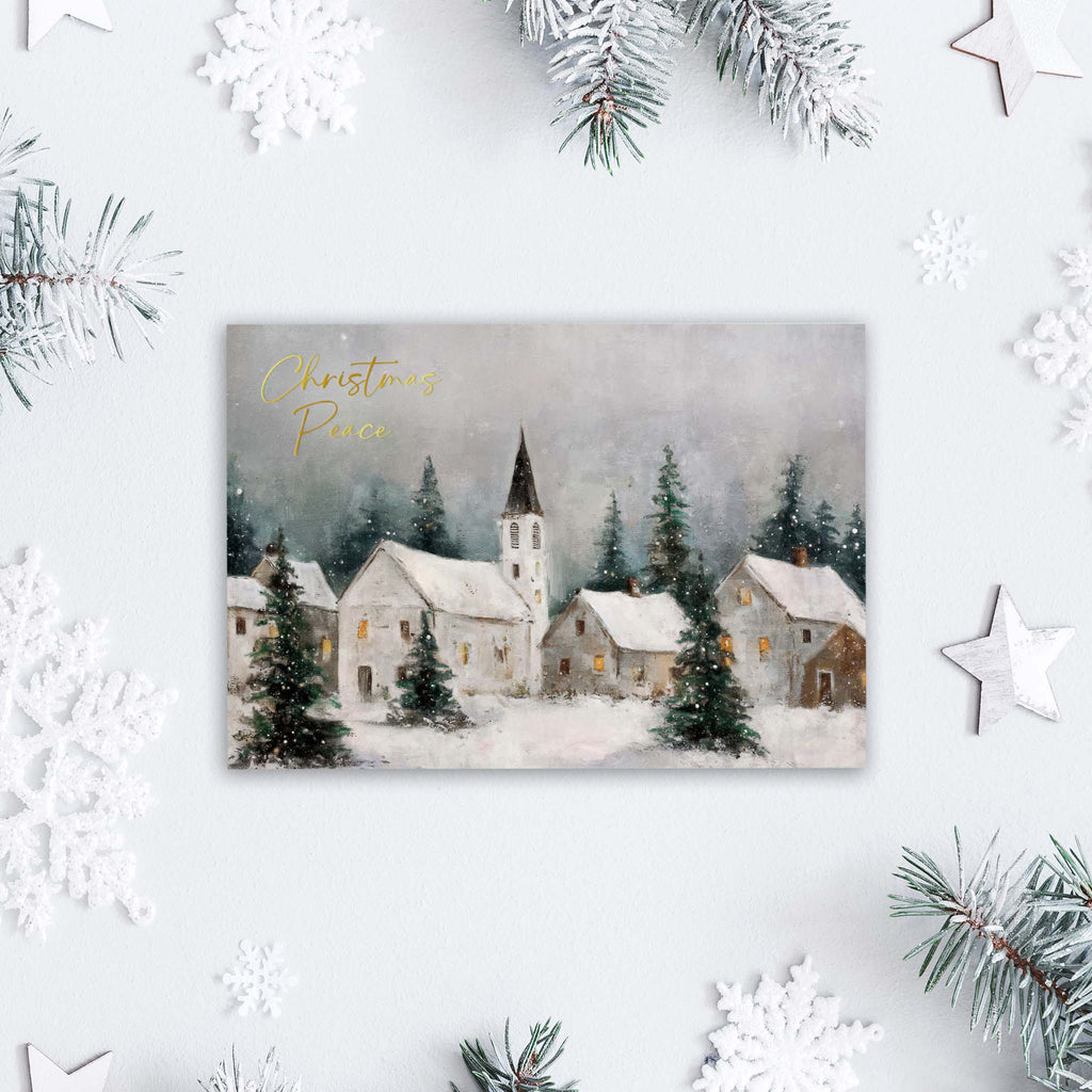 Christmas card with a snowy village scene and 'Christmas Peace' text, surrounded by festive decorations.