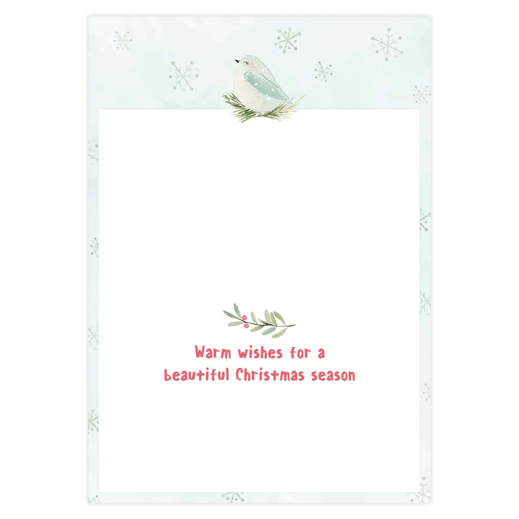 Holiday card with a bird and foliage design on a light blue background with snowflakes.