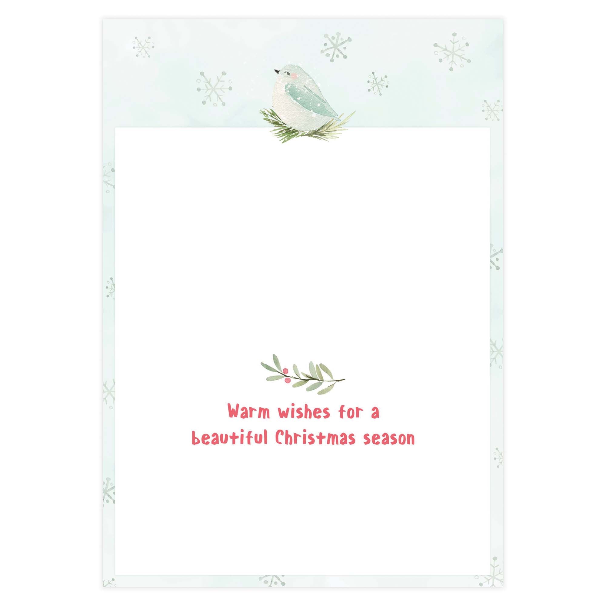 Holiday card with a bird and foliage design on a light blue background with snowflakes.