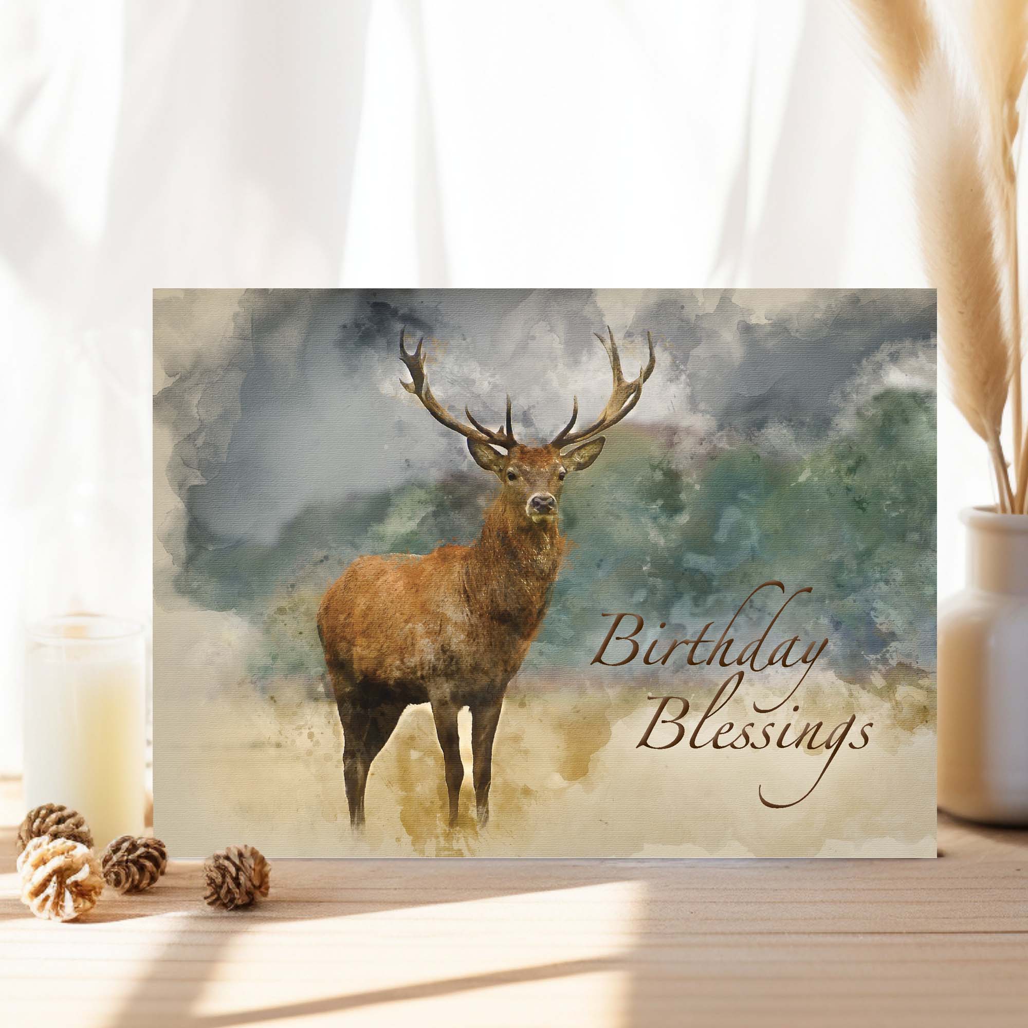 Greeting card with a deer illustration and 'Birthday Blessings' text on a decorative surface.