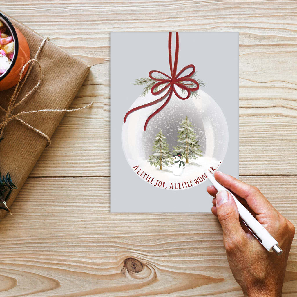 Snow Globe with Trees on desk