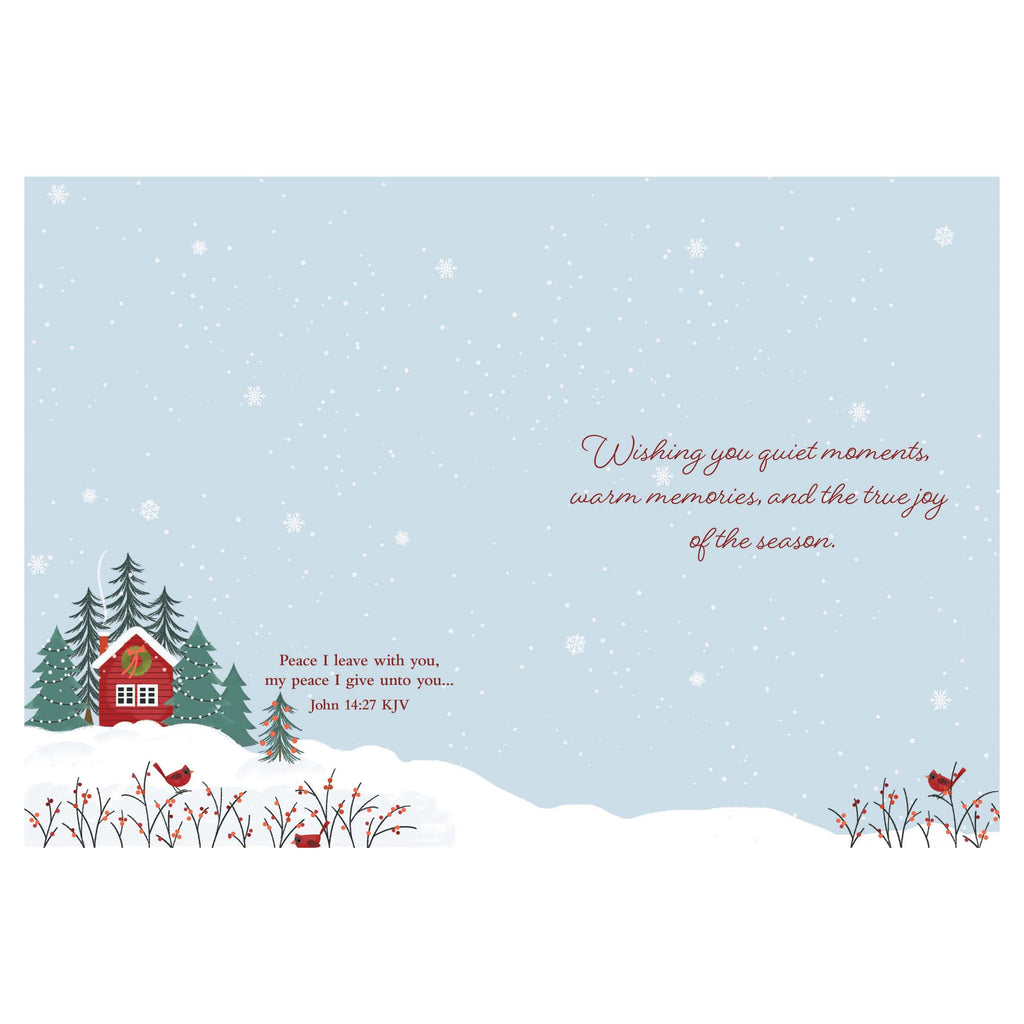 Winter scene with a cabin and trees on a light blue background with snowflakes, featuring a Christmas message.