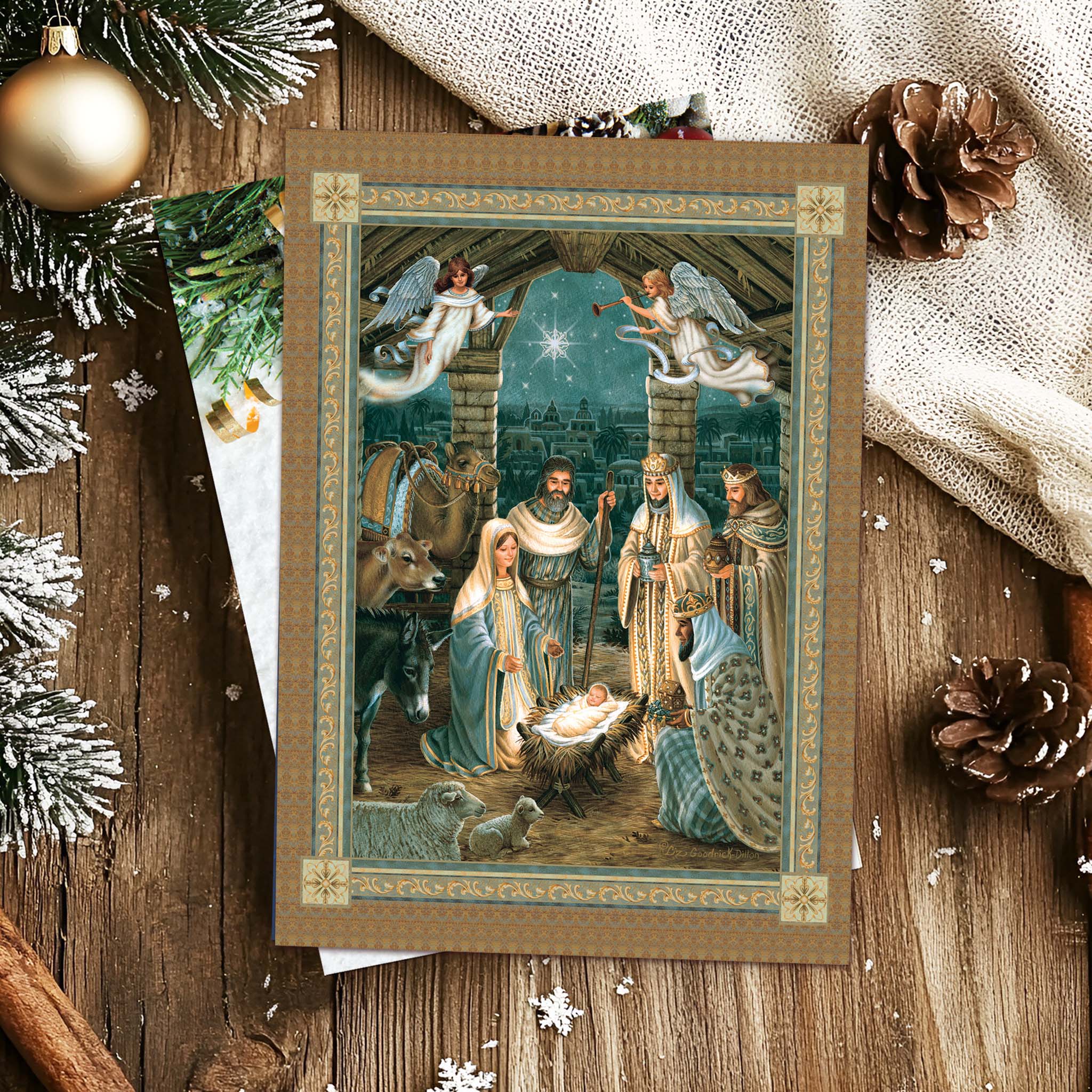 Religious Card on Table with Pine Cones and Ornaments