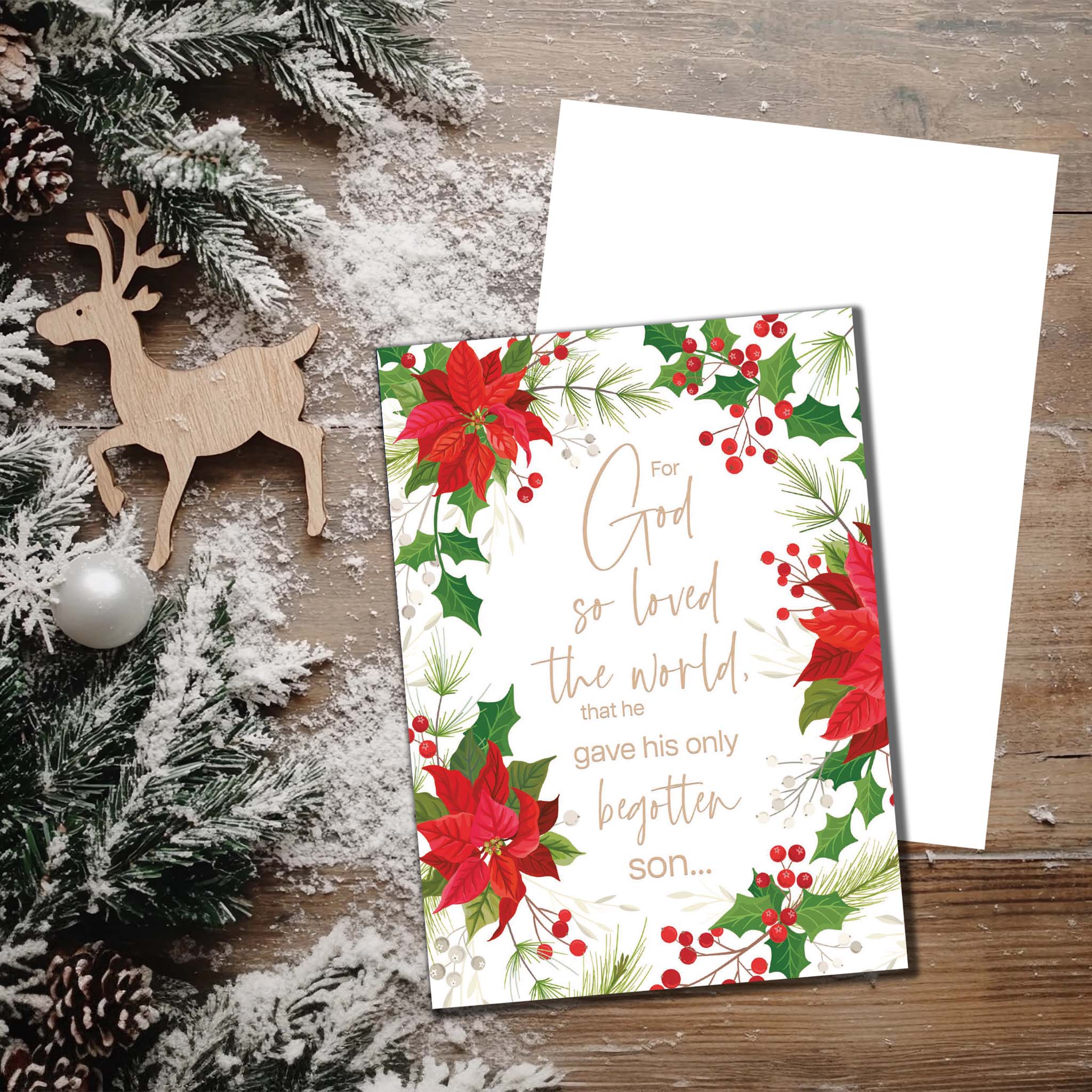 Christmas Card on Table with Deer and Pine Branches