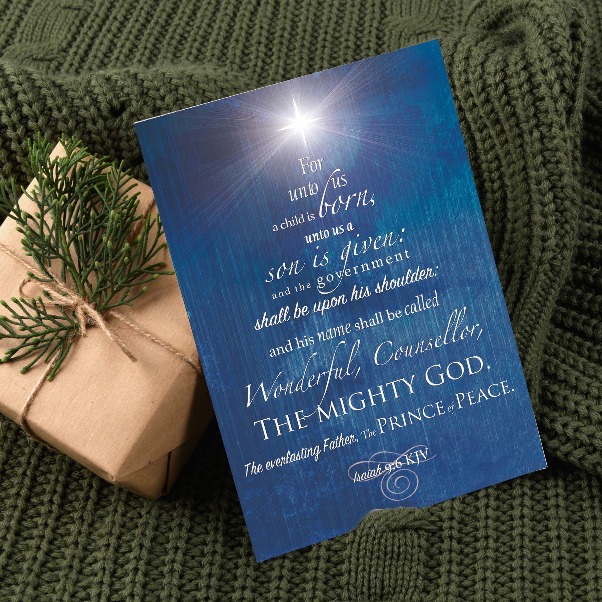 Christmas Card with Present on Green Blanket 