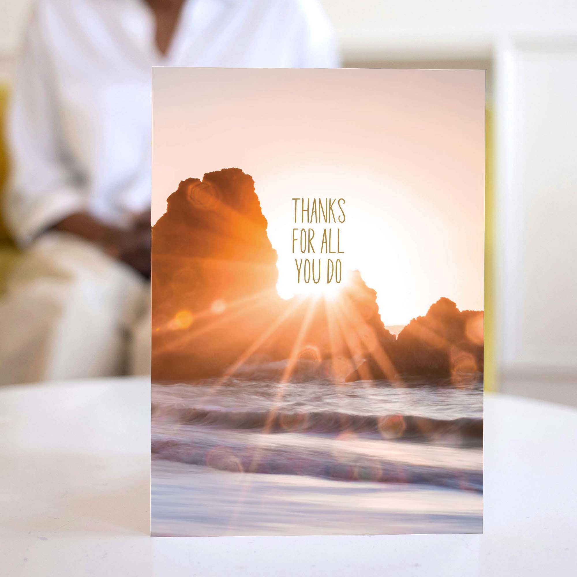 Greeting card with sunset over mountains and 'Thanks for all you do' text.