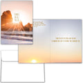 Greeting card with sunset over water design and open to reveal message inside.