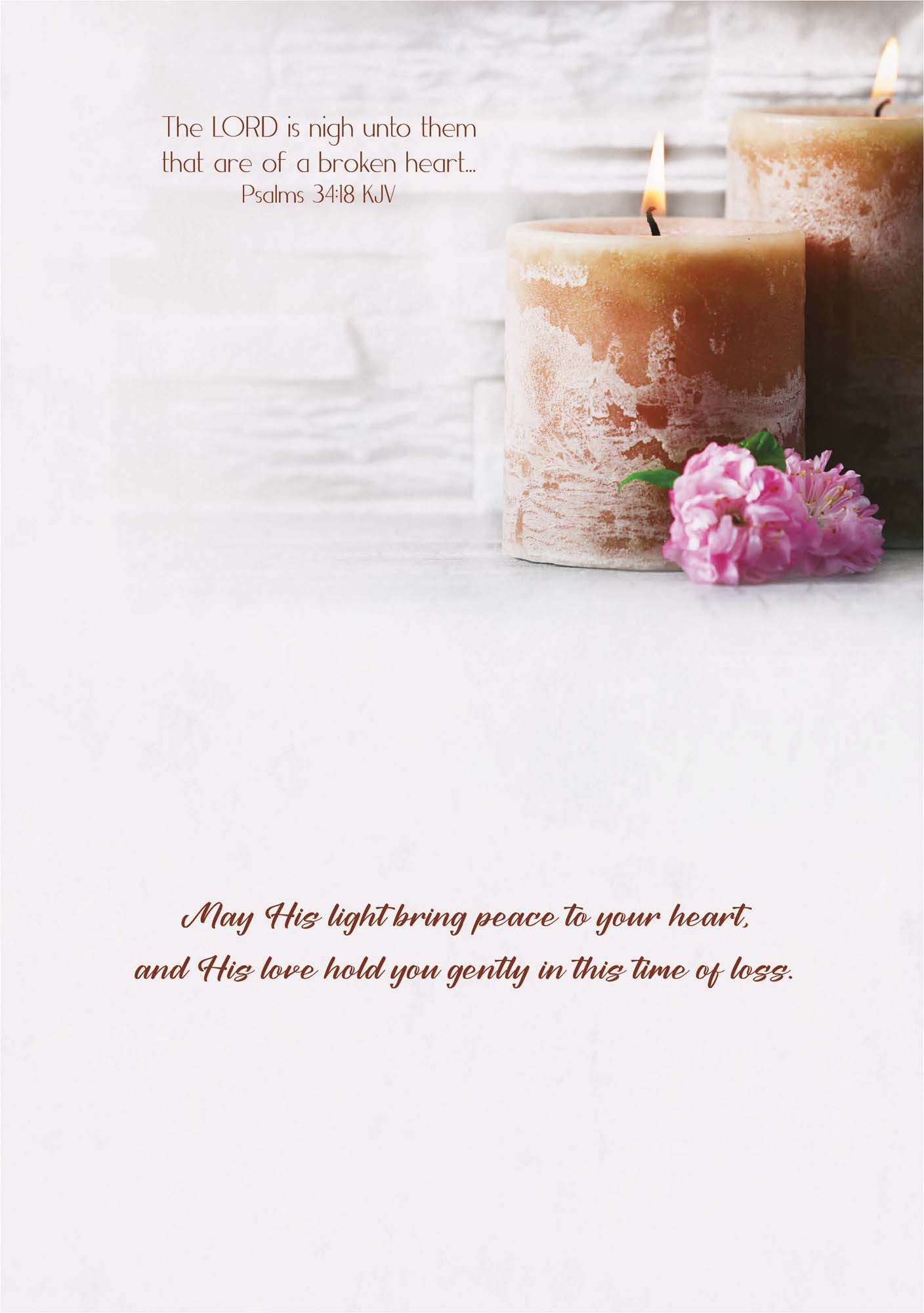 Two lit candles with a pink flower on a white background, accompanied by a Bible verse.