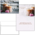 Sympathy card with candles and flowers on a wooden background