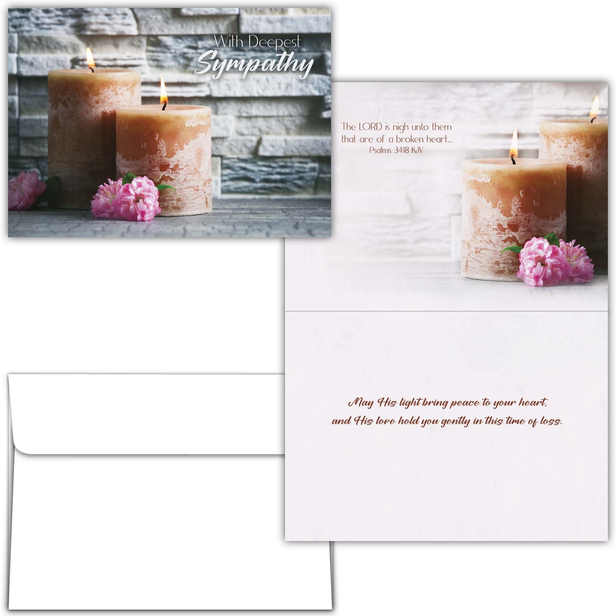 Sympathy card with candles and flowers on a wooden background