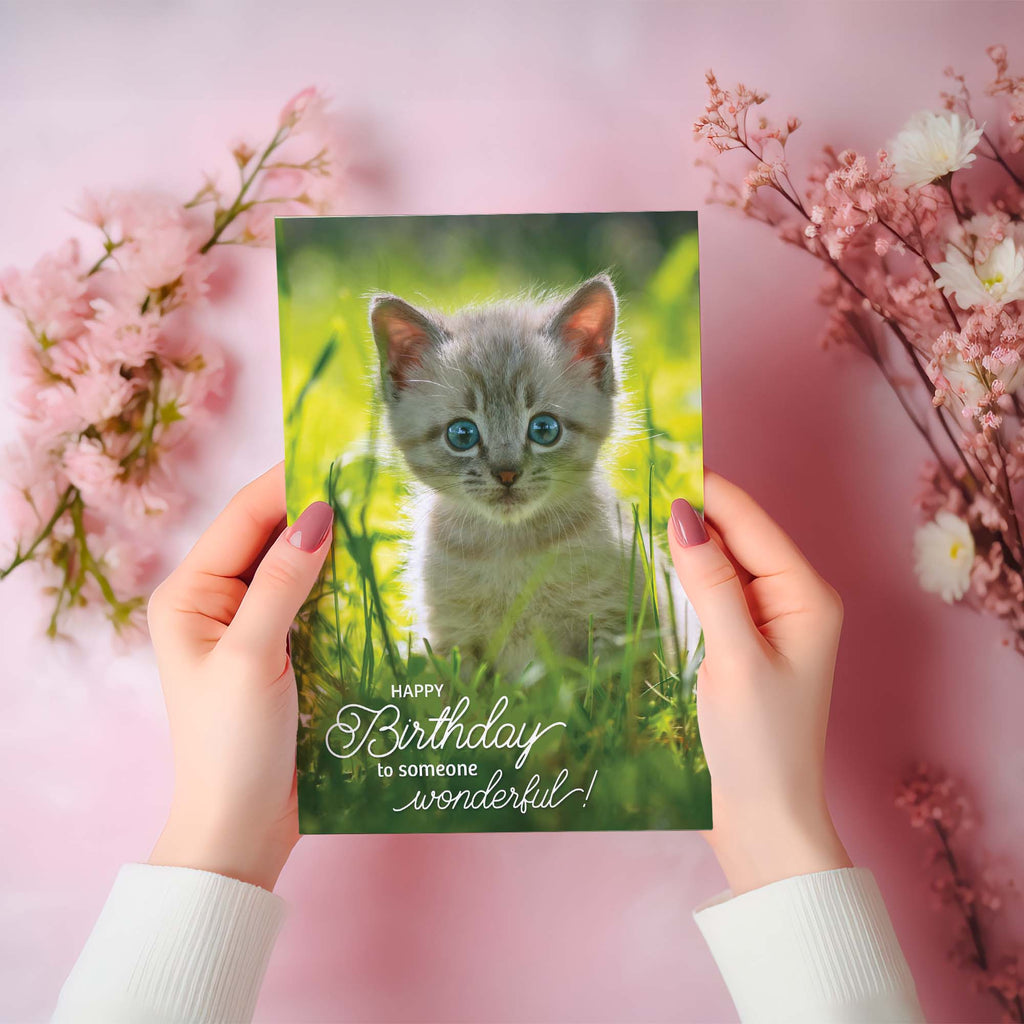 Birthday card with a kitten on a pink floral background