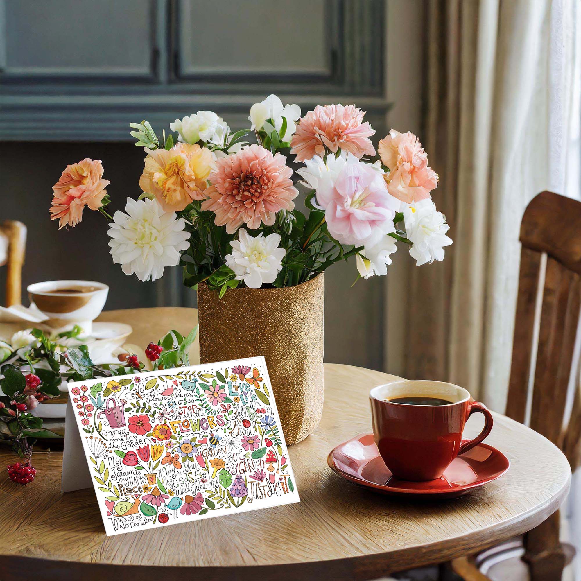 colorful card on a table with flowers and coffee cup