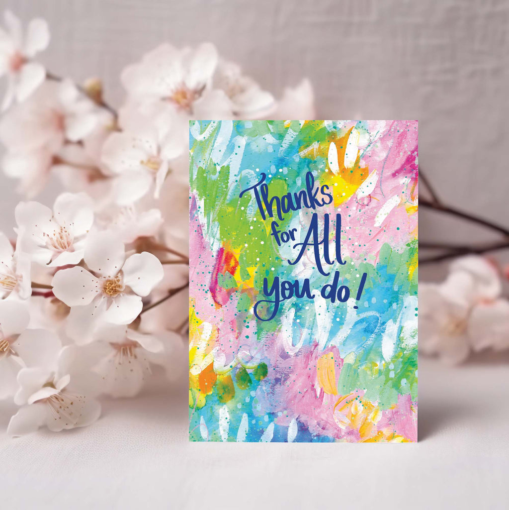 Colorful card with 'Thanks for all you do!' text, surrounded by white flowers.