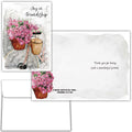 Greeting card with bicycle and pink flowers, featuring a message of friendship.