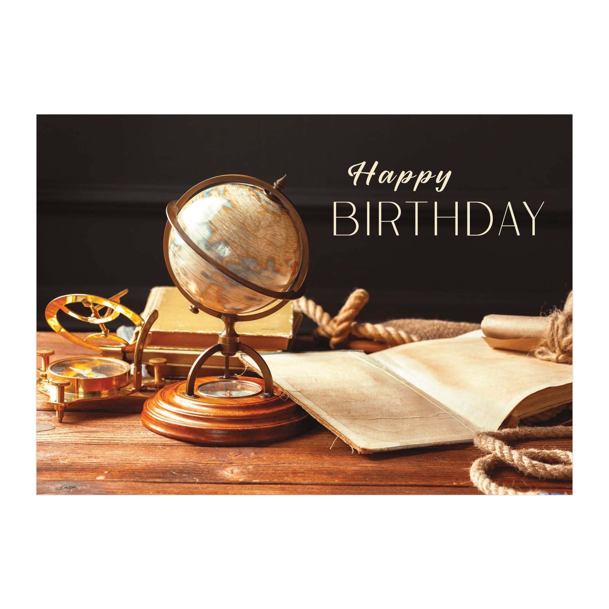 Globe, compass, and open book on a wooden surface with 'Happy Birthday' text.