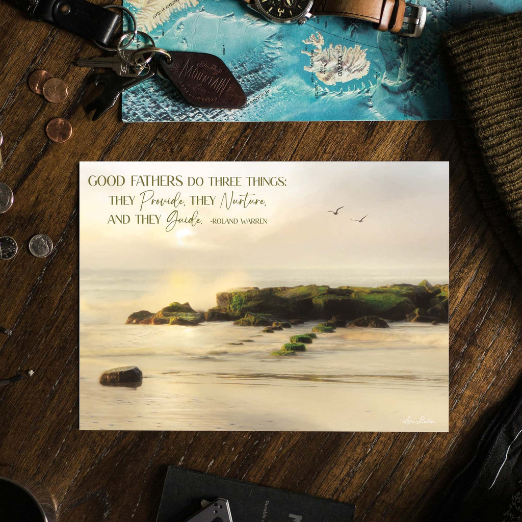 Greeting card with scenic design and text on a wooden surface with accessories.