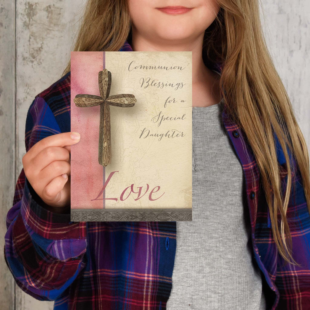 Daughter holding her communion card