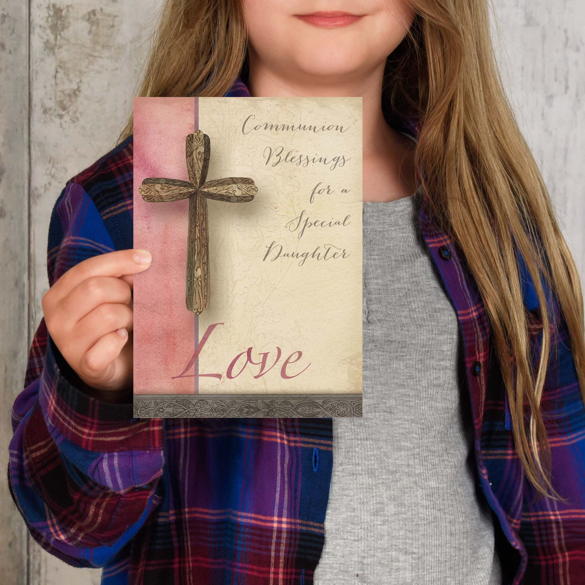 Daughter holding her communion card