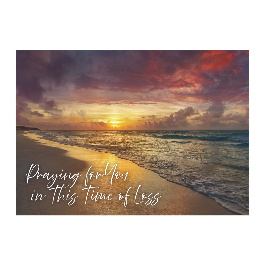 Sunset over a beach with text 'Praying for you in this time of loss'