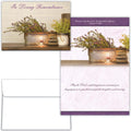 Memorial card with potted plants, candles, and comforting phrases on a white background