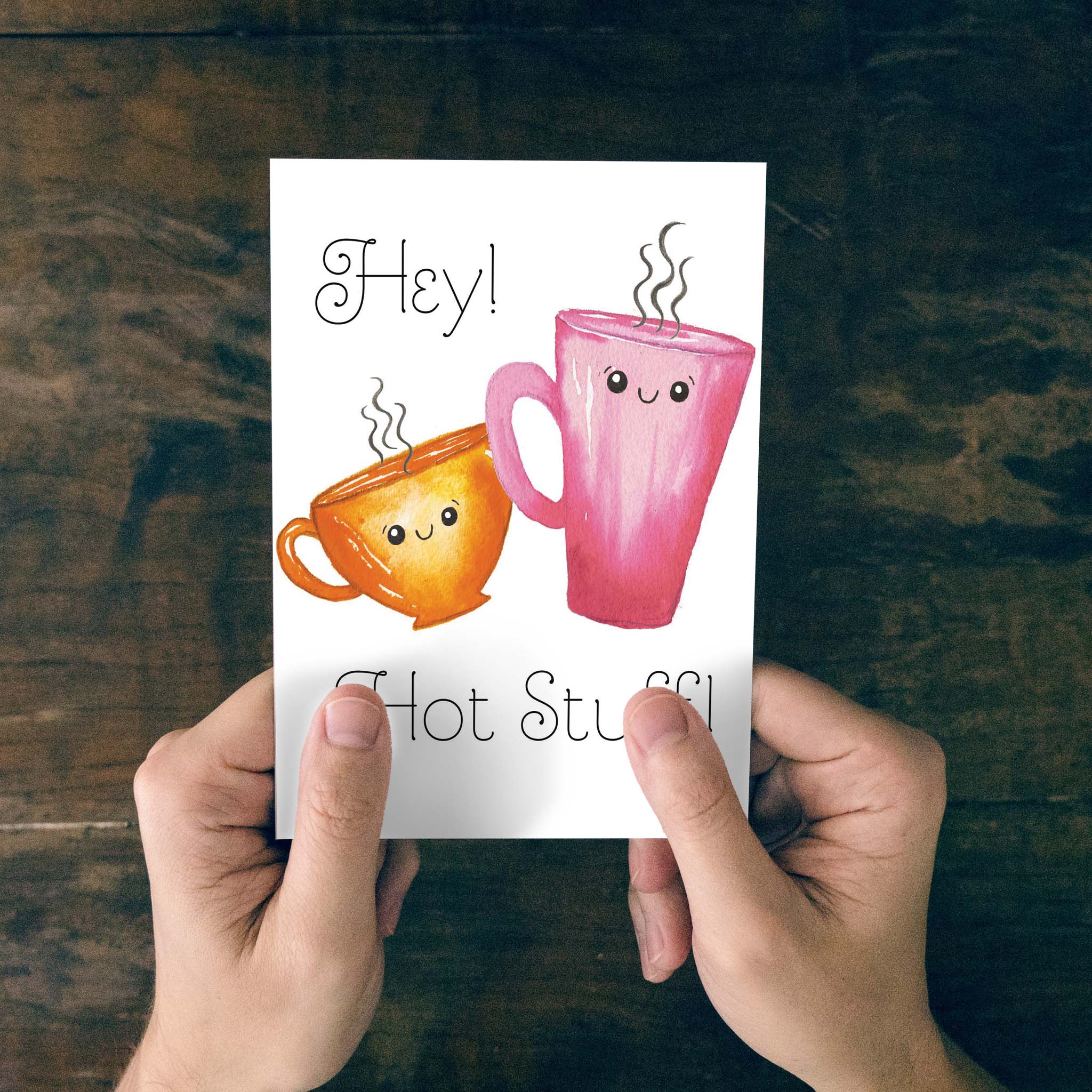 Hands holding Valentine's Day card
