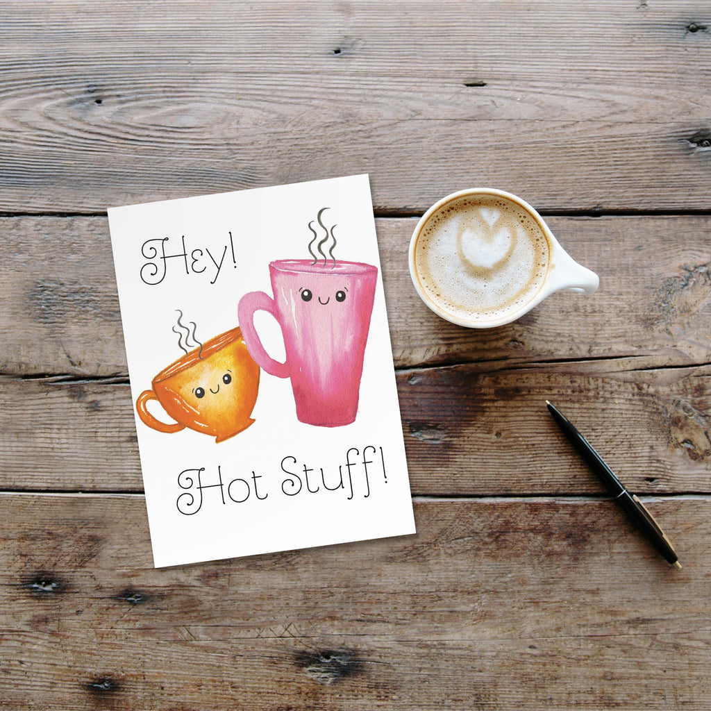 Card on table with a cup of cappucino