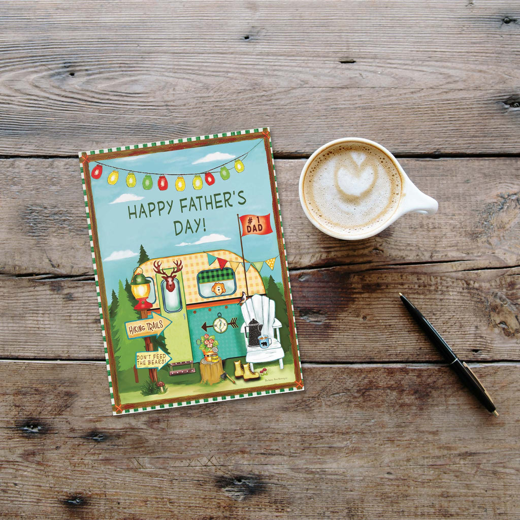 Father's Day card with a cup of coffee and pen on a wooden surface