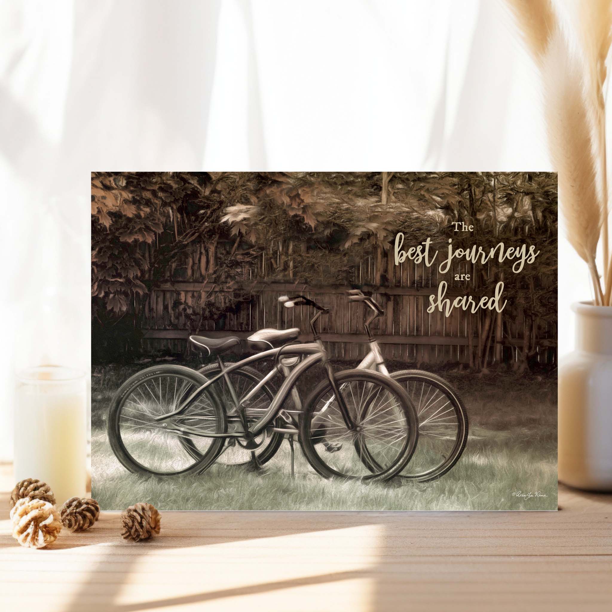 Religious Card with Bicycles on Table with Curtains in background.