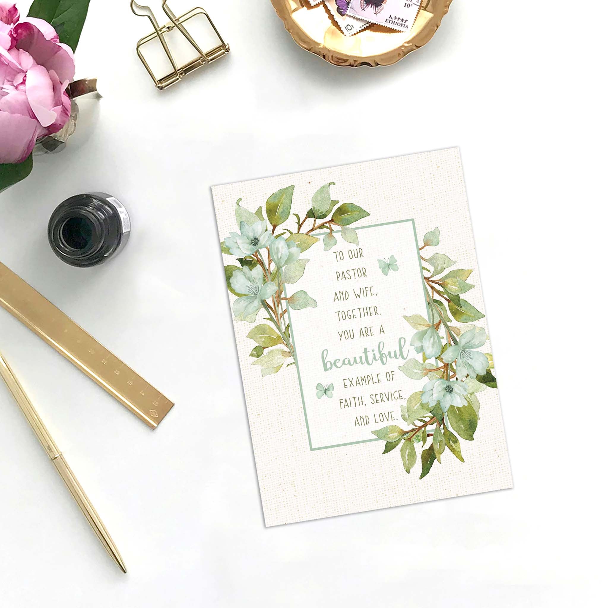 Religious Card with greenery on desk with blotter 